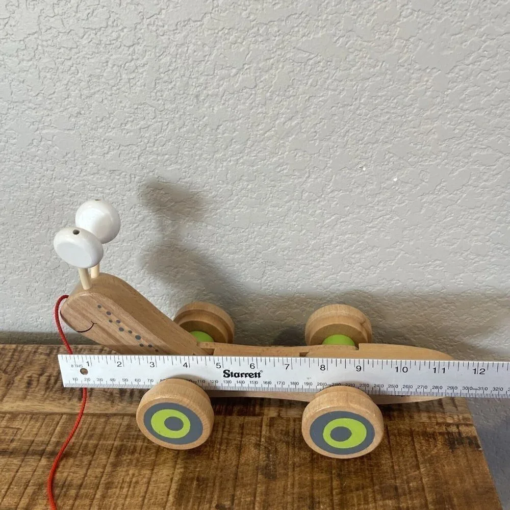 Hape Wooden Walk Along Pull Toy Snail Worm Wobbly Eyes Wheels Kids